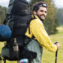Ștefan cel Mare Moment: Man with a backpack and hiking poles in a natural setting
