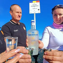 My Voronskaya Moment: Two people holding bottles and cups with 'Voronskaya' vodka against a blue sky.