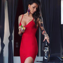 Vodka Voronskaya Black Edition - Woman in a red dress holding a cocktail and a bottle of Vodka