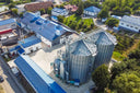 Voronskaya Vodka Factory - Aerial view of a large industrial building with silos and blue roofs.